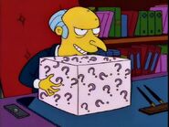 Burns attempting to bribe the safety agency with the mystery box