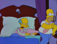 Mr. Burns poking his nightcap at Homer