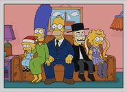 The Simpsons 5 years later. Maggie is 6, Marge is 41, Homer is 44, Bart is 15, and Lisa is 13. Bart is wearing a Guy Fawkes-like mask and clothing, while Lisa is cosplaying as Sailor Moon. 2016