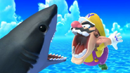 Wario facing a shark on Tortimer Island.