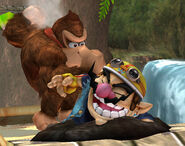 Donkey Kong attempting to attack Wario.