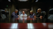 SG-1 (minus Daniel Jackson) and General George S. Hammond in the briefing room.