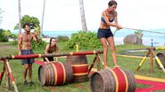 Aganoa competes in the Reward Challenge, Barrel Bridge.