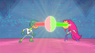 See-More and Starfire in a beam-battle.