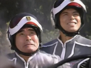 Furuhashi, with Kaji on his side, shedding a tear of joy after seeing Ultraseven back in action