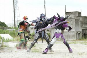 Kyoryu Greeed fighting Ankh and OOO.