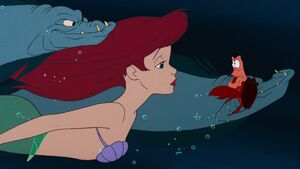 Flotsam and Jetsam smirking when Sebastian questions Ariel what she's doing with them.