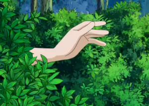 The Ghost Girl's first appearance, waving her hands in the bushes