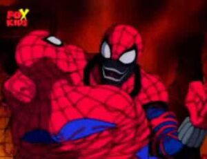 Spider-Carnage grabs hold of Spider-Man during their fight.