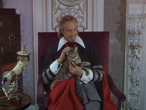 Monsieur Richelieu petting a cat.