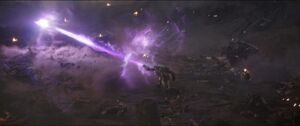 Thanos uses the power of the Power Stone to punch Captain Marvel out of the fight.