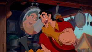 Gaston admiring himself through a mirror.