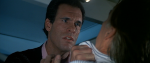 Sanchez confronting his henchman Milton Krest after Bond frames him.