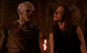 The First Evil in the form of Drusilla (right) with a Turok-Han vampire (left).