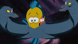 Flotsam and Jetsam silencing Flounder and Sebastian to keep them from convincing Ariel to object Ursula's deal.