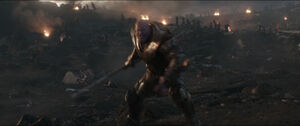 Thanos runs towards the Nano Gauntlet.