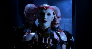 Angelique, transformed as The Princess of Torment Cenobite, holding the puzzle box.