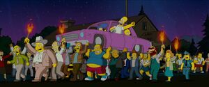 Snake with the angry mob in The Simpsons Movie.