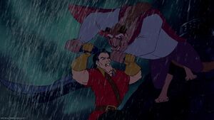 Gaston struggling as the Beast viciously fights back.