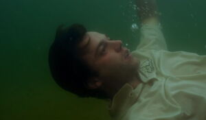 Whitaker attempting to drown himself.