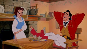 Gaston rests his feet on Belle's book.