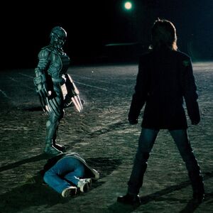 Sloth Orphnoch facing Takumi over the body of a Ryusei student