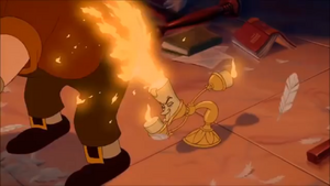 Tom getting his rear end burned by Lumière.