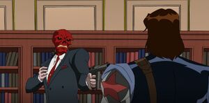 Red Skull about to shoot and kill the Winter Soldier for disobeying him.