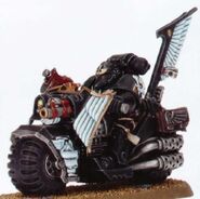 A Dark Angels Ravenwing Astartes with a bike-mounted Auxiliary Grenade Launcher.