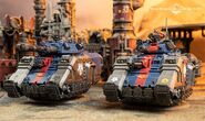 An Iron Ravens Repulsor Executioner and Repulsor grav-tanks, from left to right.