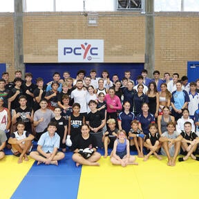 Joanna Jedrzejczyk and Merab Dvalishvili joined PCYC - NSW for a day of mentorship and training, fostering discipline, resilience, and community during UFC 312 fight week on February 8