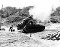 A 155-mm howitzer firing adjusting rounds near Kumhwa, Korea, 8 June 1952.