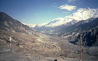 Village of Manang in the broad Manang valley of the Marshyangdi river in 1985. To the right is the Annapurna mountain range.