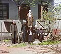 A group of Mullahs sit on the stairs of the Mosque of Azizy near Batumi. Ca. 1910, Georgia