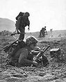 A carbine-equipped Marine on Iwo Jima, February 1945.