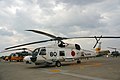 A JMSDF SH-60J in Okadama Airport, with a JASDF UH-60J behind it