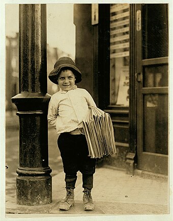 Newsboy. Little Fattie. Less than 40 inches high, 6 years old. Been at it one year. May 9th, 1910. Location: St. Louis, Missouri.