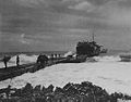 Saipan. Unloading trucks at the temporary pier created at the beachhead from pontoon barges. June 1944