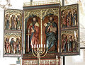 Altar piece from Valleberga church in Sweden. St Bartholomew (on the right in the top row on the left wing) holds a girdle book in his left hand.