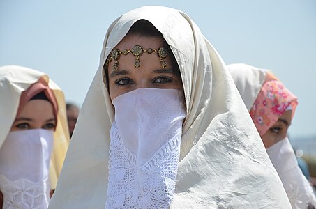 Women in haïk at the port of Algiers, Algeria by Mustapha Brahim Djelloul