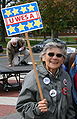 Woman at a Ned Lamont rally Clark attended at the University of Connecticut holds a sign with one of Clark's slogans