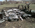 A US Army documentation team surveys the wreckage of a Former Republic of Yugoslavia MiG-29 Fulcrum jet fighter outside the town of Ugljevik, Bosnia and Herzegovina, on March 27, 1999.