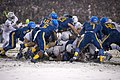 Army Black Knights vs. Navy Midshipmen on a snow covered field