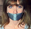 Model Lorelei wearing a tape gag