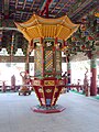 Ornate Buddhist artifact on the second floor of one the entry gates at Wolijeongsa