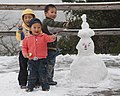 * Nomination Huanglong, Sichuan, China: Three chinese boys posing in front of their snowman which features almond shaped eyes and the local head gear. The altitude of their playground is at 4000 m --Cccefalon 07:22, 21 January 2015 (UTC) * Promotion  Support Thank you for that awesome image of those three Chinese boys! Venerable! --Johann Jaritz 07:36, 21 January 2015 (UTC)