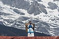 * Nomination Lijiang, Yunnan, China: Naxi woman carrying the typical baskets of the region; scene from a public perfomance in Jade Dragon Snow Mountain Open Air Theatre. --Cccefalon 06:19, 23 December 2014 (UTC) * Promotion Good quality. --Hubertl 09:36, 23 December 2014 (UTC)