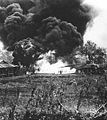 Tank-mounted flamethrower incinerates a Japanese pillbox on Saipan. June 1944.