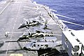 Two AV-8As and a UH-1 parked on the flight deck of the amphibious assault ship USS NASSAU (LHA-4)