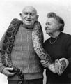 Aharon Shulov and his wife, Yocheved, holding a python